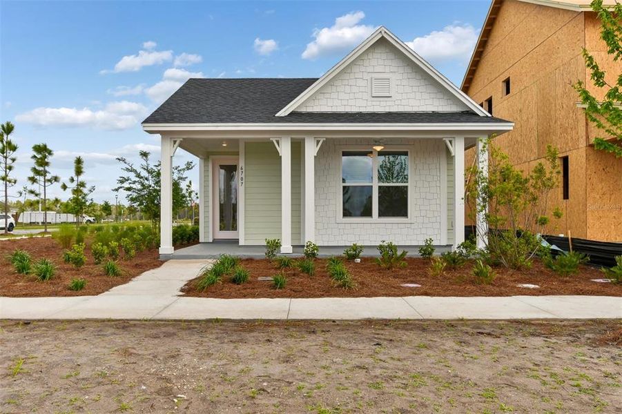 Front exterior of a new home in Weslyn Park in Sunbridge 34', St. Cloud, FL, highlighting curb appeal (Image 19).