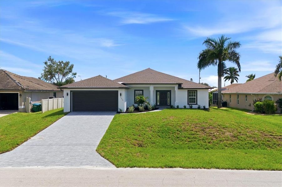 Front exterior of a new home in , Cape Coral, FL, highlighting curb appeal (Image 27).