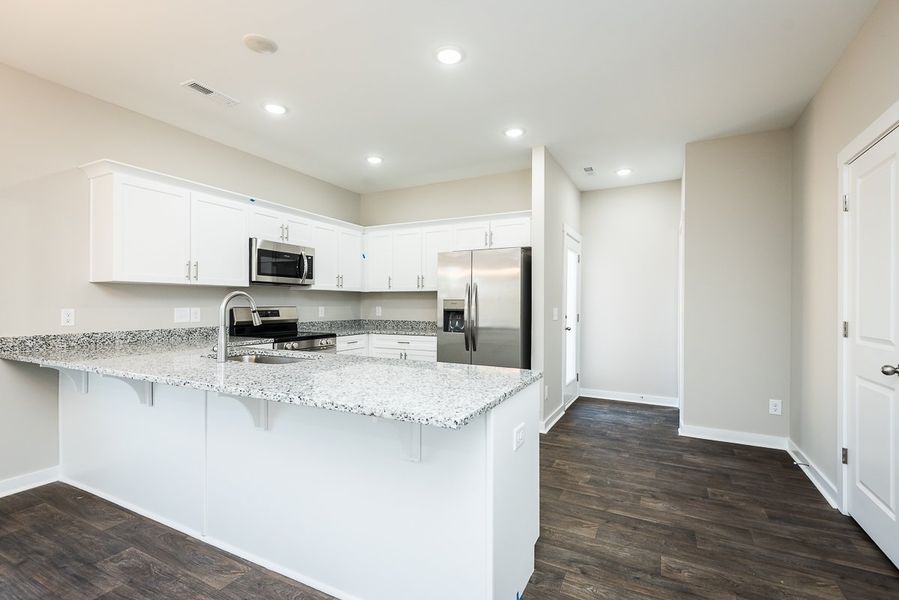 Representative furnished interior of a home built from the TH 1425 END by Foundation Home Builders LLC in Stokesburg Road Townhomes, Walnut Cove (Image 4).