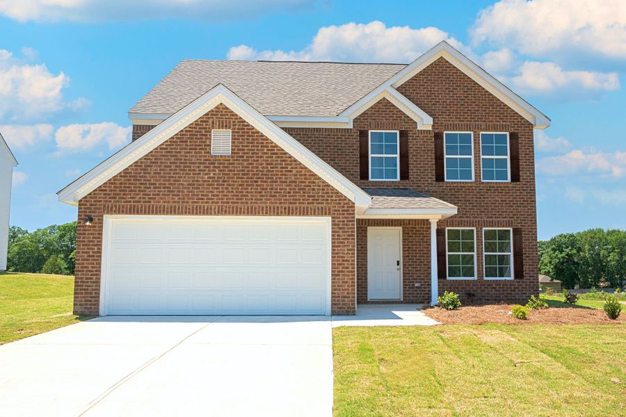 Front exterior of a new home in David's Place, Warner Robins, GA, highlighting curb appeal (Image 1).