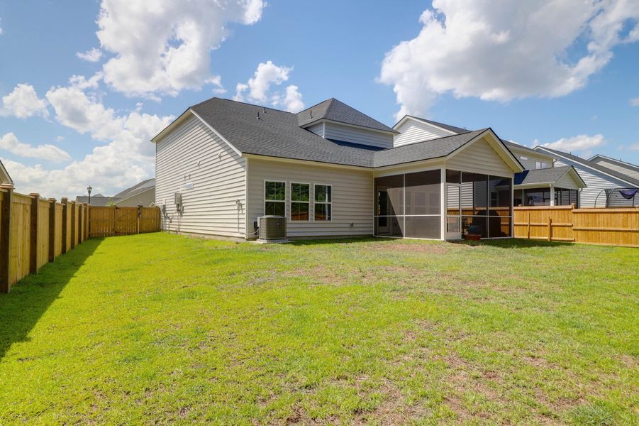 Exterior details and patio area of a home in Sweetgrass at Summers Corner: Arbor Collection, Summerville (Image 24).