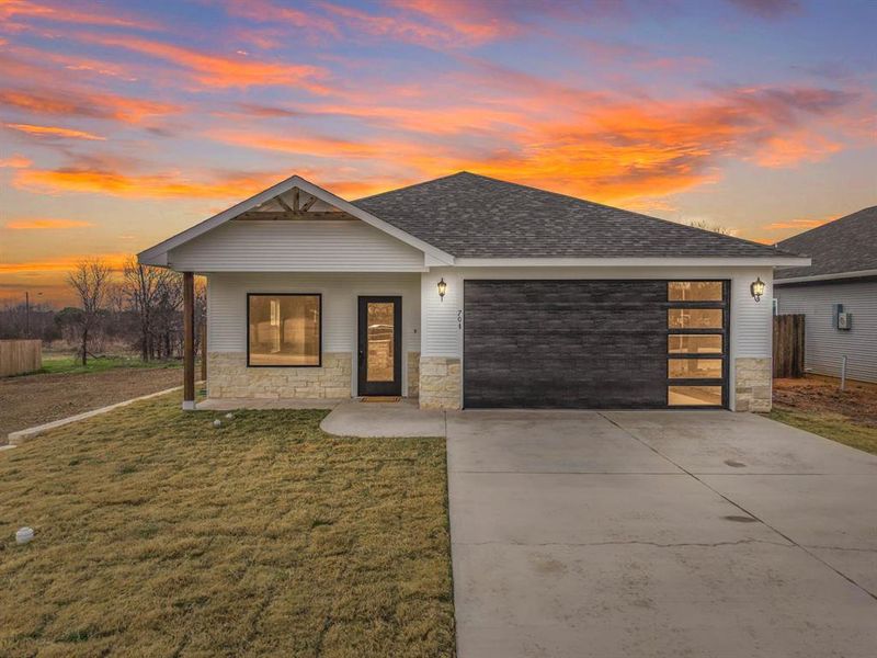 Front exterior of a new home in , Hillsboro, TX, highlighting curb appeal (Image 1). Front exterior of a new home in , Hillsboro, TX, highlighting curb appeal (Image 1).