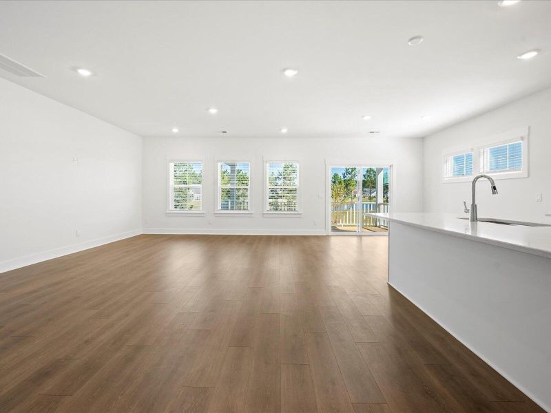 Spacious, unfurnished interior of a new home in The Coves at Lakes of Cane Bay, Summerville (Image 25).
