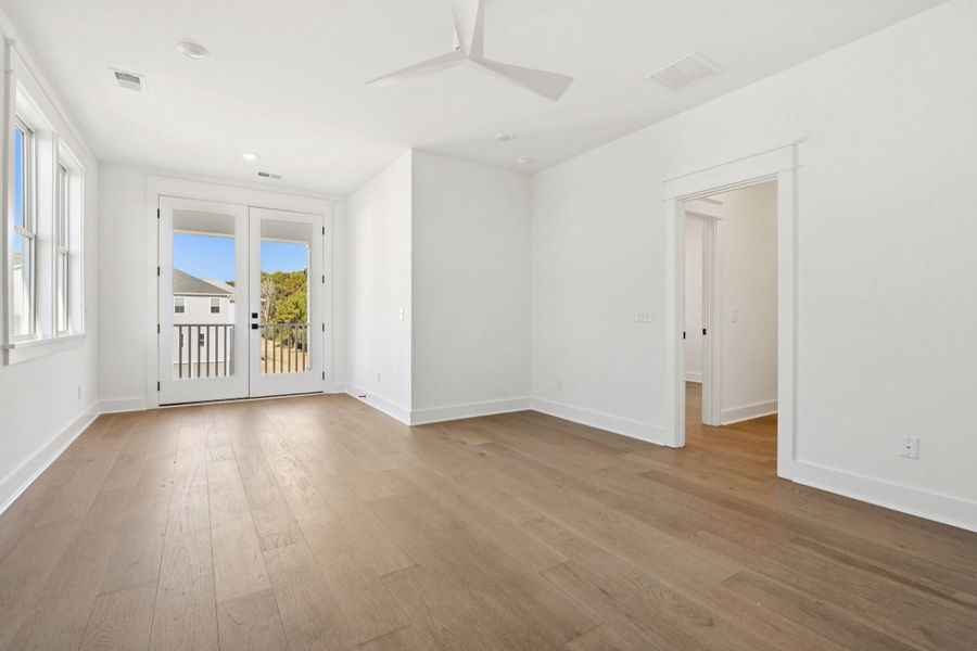 Spacious, unfurnished interior of a new home in Overlook at Copahee Sound, Awendaw (Image 68).