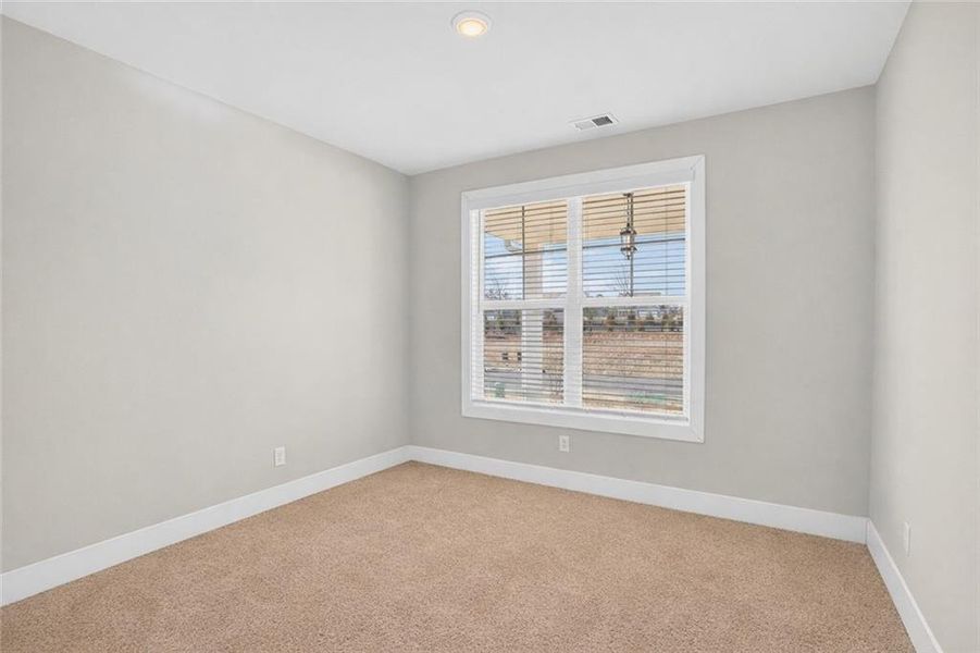 Spacious, unfurnished interior of a new home in The Fairways at Mirror Lake, Villa Rica (Image 23).