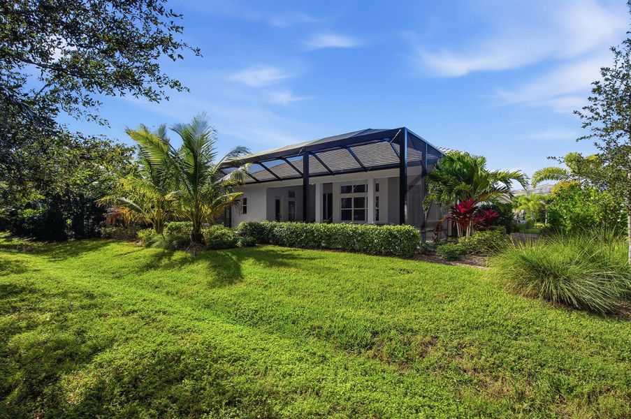 Front exterior of a new home in The Strand, Vero Beach, FL, highlighting curb appeal (Image 27).