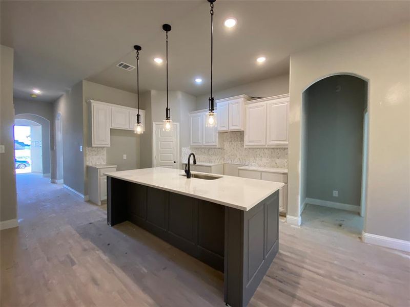 Inviting kitchen at the heart of the home (hardwoods not stained Aged Barrel Grey w/Black tint yet) Inviting kitchen at the heart of the home (hardwoods not stained Aged Barrel Grey w/Black tint yet)