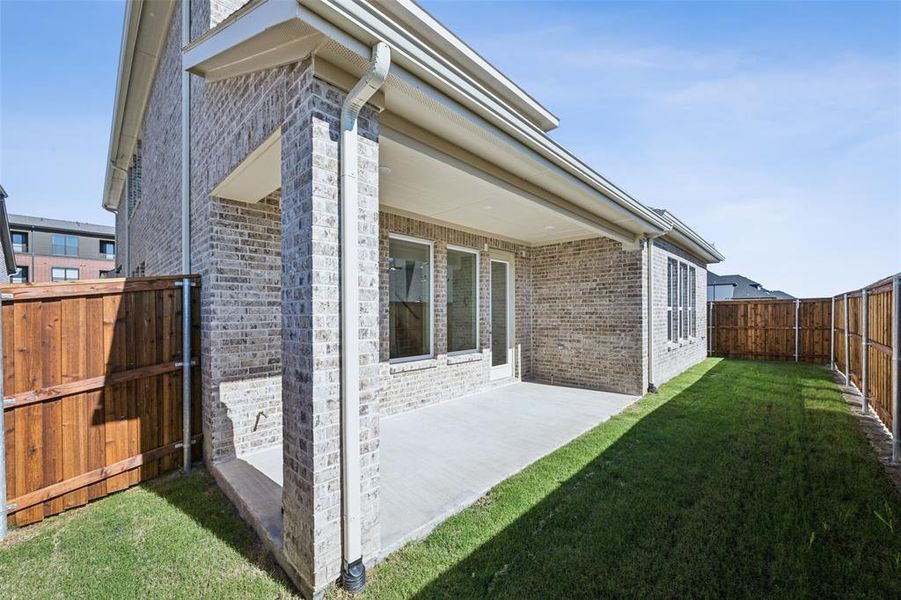 Dining al fresco is in your future on this nicely sized covered back patio.