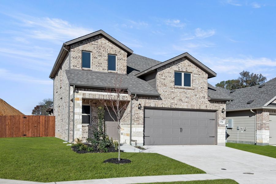 Front exterior of a new home in Keeneland, Aubrey, TX, highlighting curb appeal (Image 2). Front exterior of a new home in Keeneland, Aubrey, TX, highlighting curb appeal (Image 2).