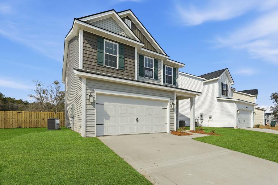 Representative exterior photo of a completed home built from the The Stacy by RTS Homes in Grand Reserve, Hinesville, GA (Image 20). Representative exterior photo of a completed home built from the The Stacy by RTS Homes in Grand Reserve, Hinesville, GA (Image 20).