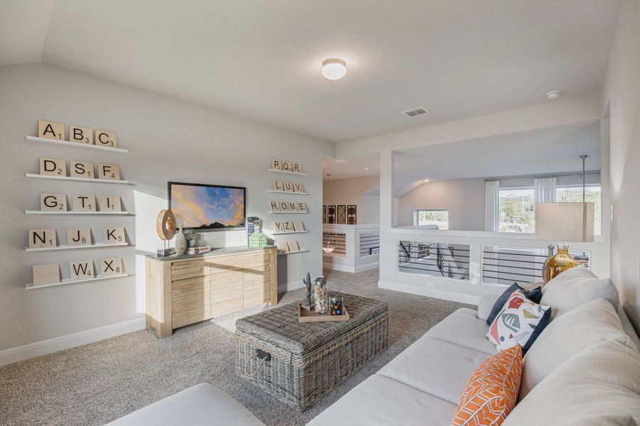 Representative furnished interior of a home built from the Lincoln by Chesmar Homes in Stillwater Ranch, San Antonio (Image 5).