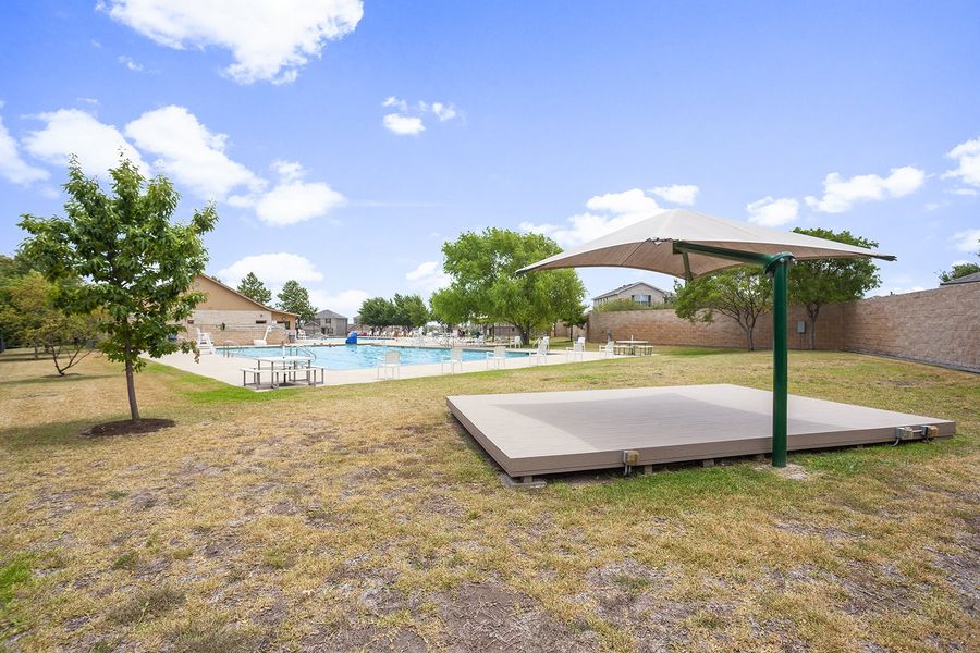 A swimming pool with a covered area. A swimming pool with a covered area.