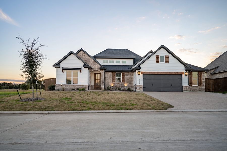 Representative exterior photo of a completed home built from the The Savannah by Reece Homes in Stella Ranch, Bryan, TX (Image 31). Representative exterior photo of a completed home built from the The Savannah by Reece Homes in Stella Ranch, Bryan, TX (Image 31).