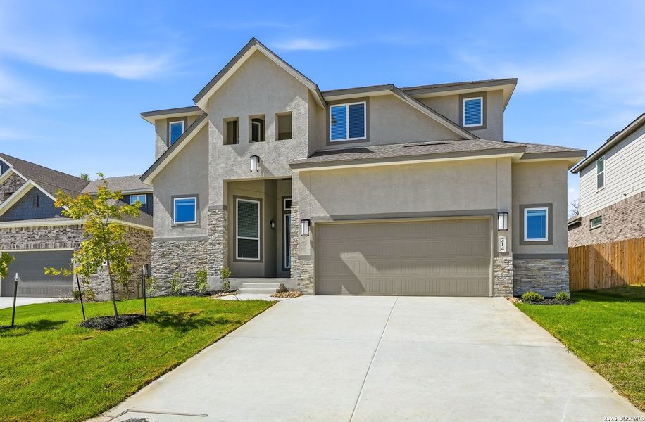 Front exterior of a new home in Buffalo Crossing, Cibolo, TX, highlighting curb appeal (Image 22).