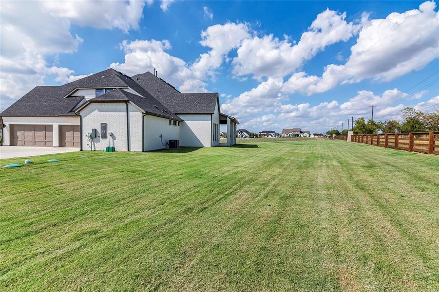 View of yard featuring a garage