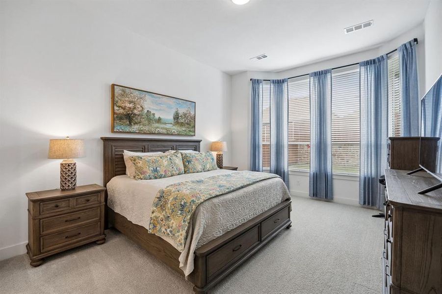 Bedroom featuring light gray carpet flooring