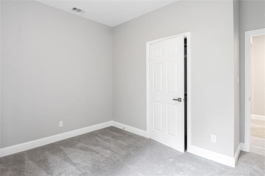 Unfurnished bedroom with carpet