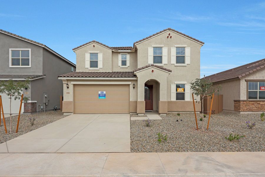 Front exterior of a new home in Landmarke, San Tan Valley, AZ, highlighting curb appeal (Image 1). Front exterior of a new home in Landmarke, San Tan Valley, AZ, highlighting curb appeal (Image 1).