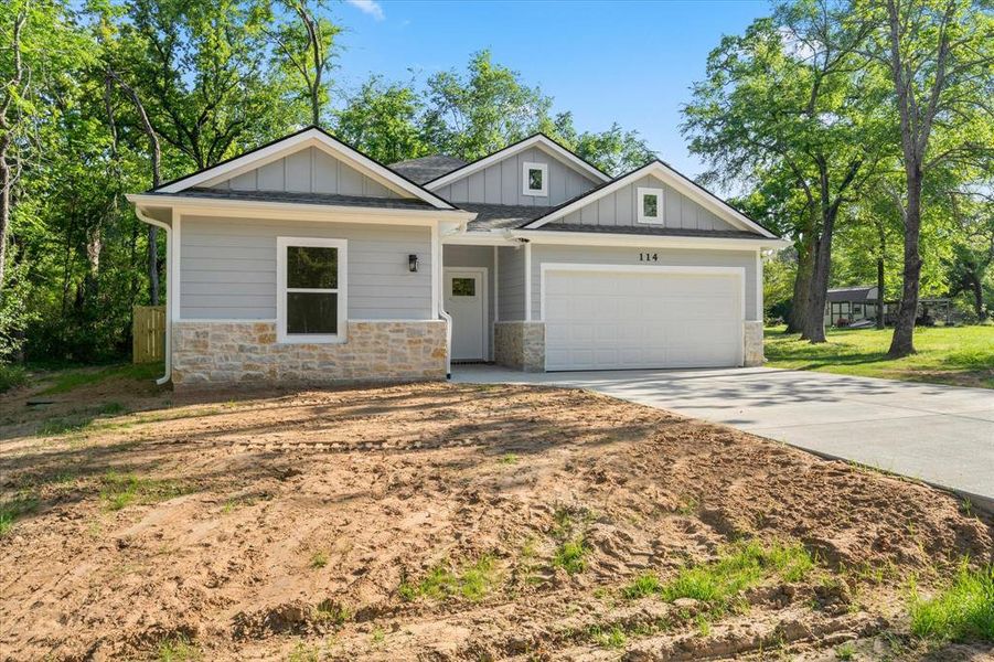 Front exterior of a new home in , Payne Springs, TX, highlighting curb appeal (Image 17). Front exterior of a new home in , Payne Springs, TX, highlighting curb appeal (Image 17).