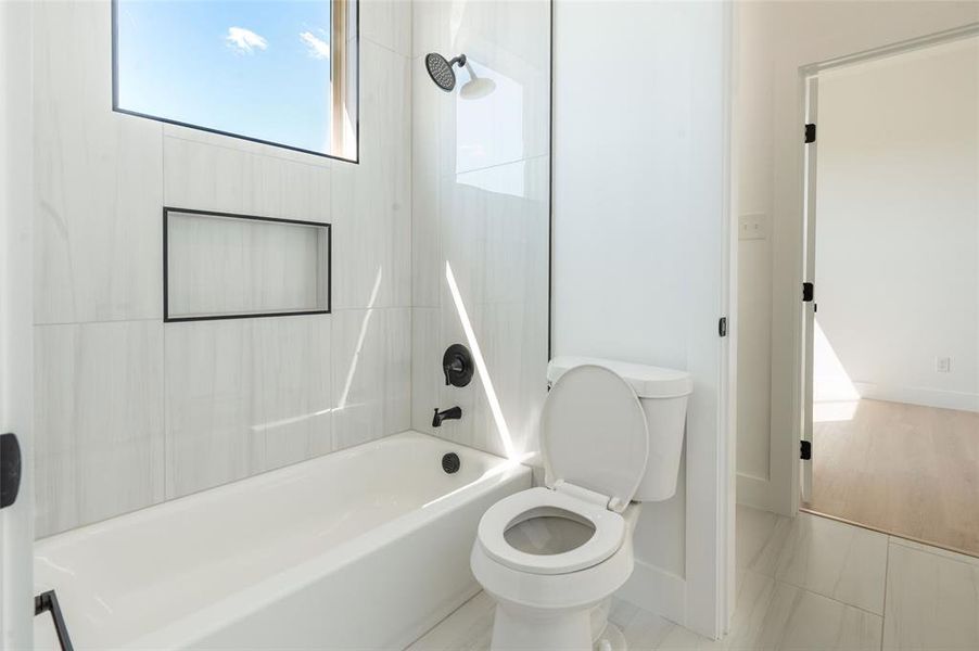 Convenient Jack-and-Jill bathroom connecting two secondary bedrooms