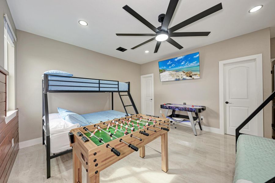 Gleaming tile floors and recessed lighting enhance this versatile secondary bedroom space. Gleaming tile floors and recessed lighting enhance this versatile secondary bedroom space.