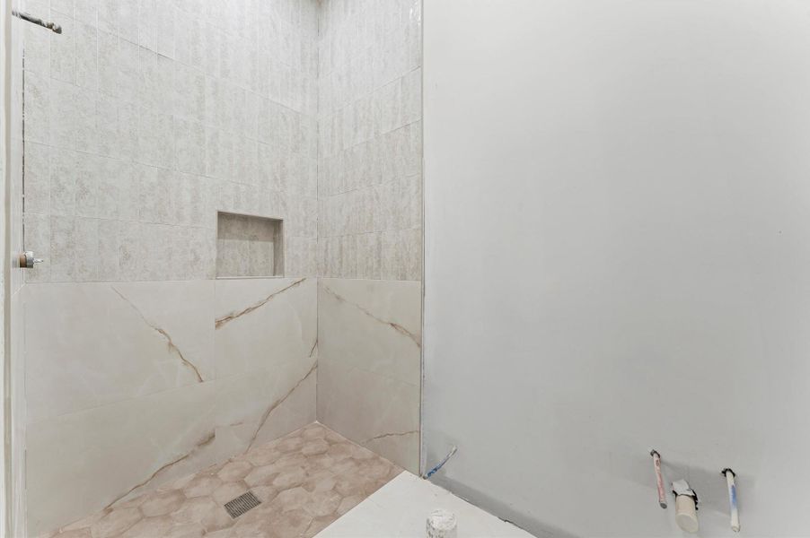 Full bathroom with large shower on the first floor.