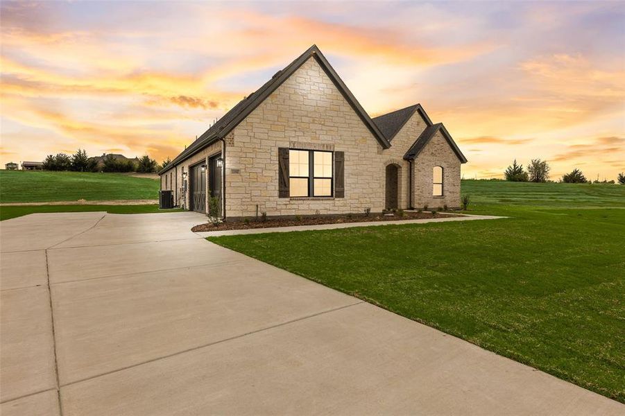 Front exterior of a new home in King Crossing Estates, Van Alstyne, TX, highlighting curb appeal (Image 25). Front exterior of a new home in King Crossing Estates, Van Alstyne, TX, highlighting curb appeal (Image 25).