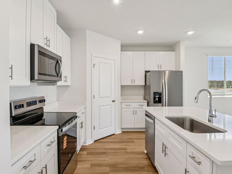 Furnished interior view inside a new home in Hilltop Vistas, Dade City (Image 6).