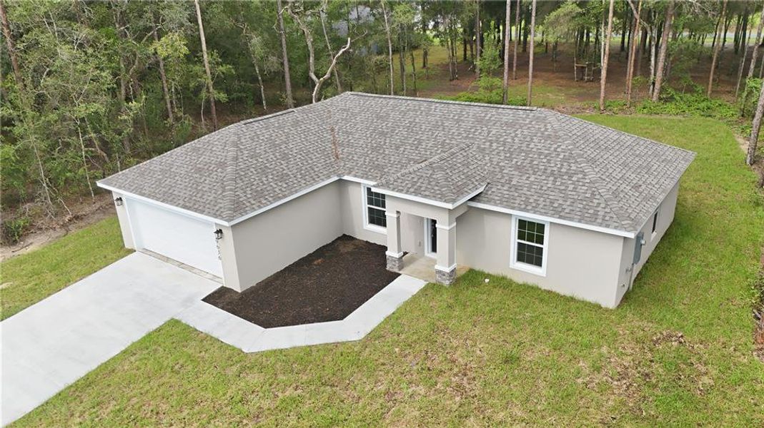 Front exterior of a new home in , Citrus Springs, FL, highlighting curb appeal (Image 23).