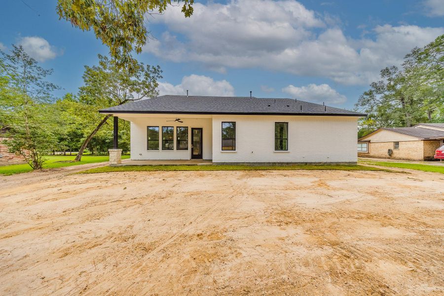Cozy covered patio deck in the backyard, perfect for relaxing outdoors, entertaining guests, and enjoying the fresh air. Cozy covered patio deck in the backyard, perfect for relaxing outdoors, entertaining guests, and enjoying the fresh air.