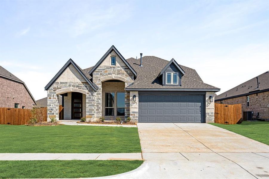 Front exterior of a new home in Sable Creek, Sanger, TX, highlighting curb appeal (Image 20).