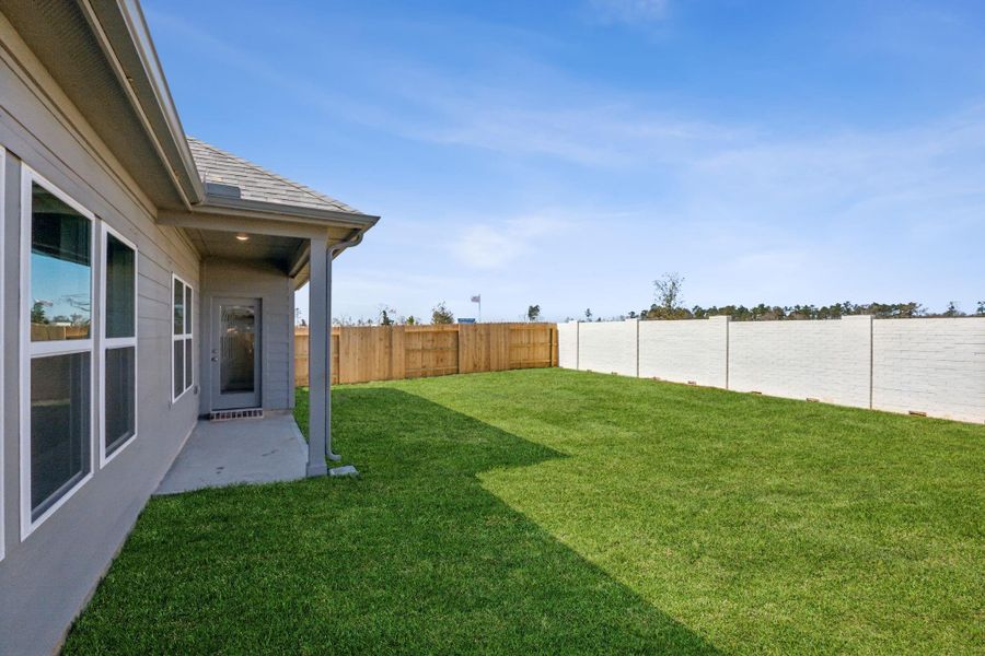 Front exterior of a new home in Saint Tropez, Huffman, TX, highlighting curb appeal (Image 23).