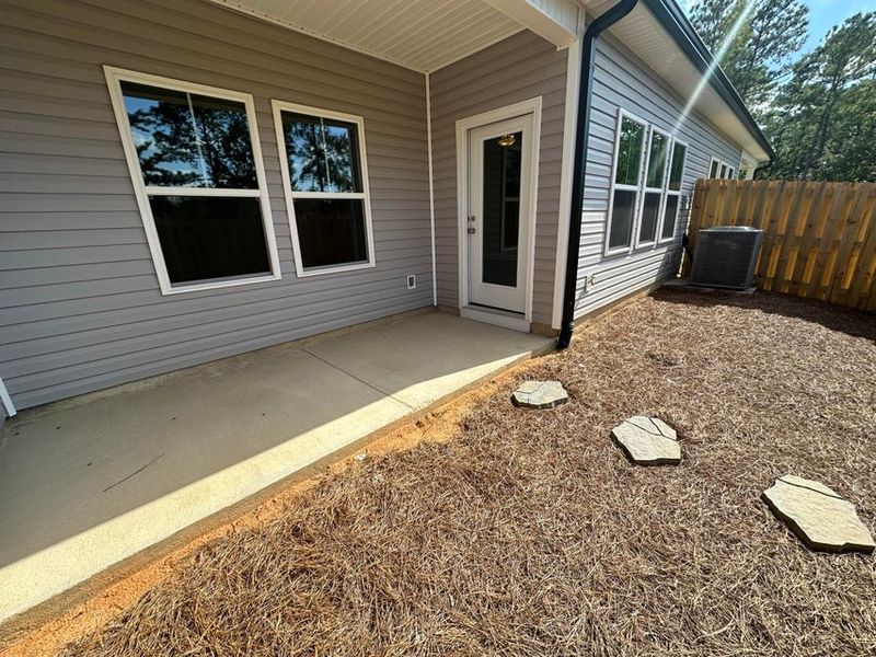 Exterior details and patio area of a home in Windsor Townhomes, North Augusta (Image 3).