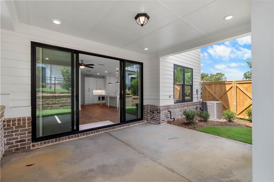 Exterior details and patio area of a home in Millcroft Townhomes, Buford (Image 3).