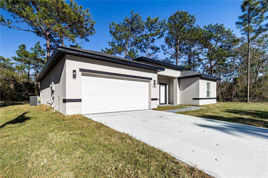 Front exterior of a new home in , Citrus Springs, FL, highlighting curb appeal (Image 17).