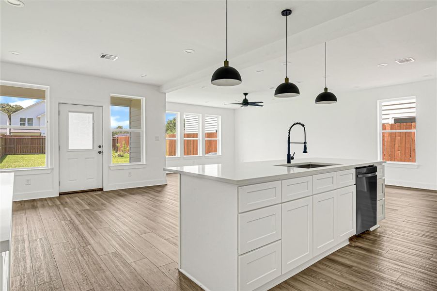 Open-concept layout connecting the kitchen, dining, and living spaces. Open-concept layout connecting the kitchen, dining, and living spaces.