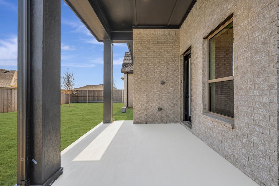 Exterior details and patio area of a home in Goodland – Classic Series, Grand Prairie (Image 4).