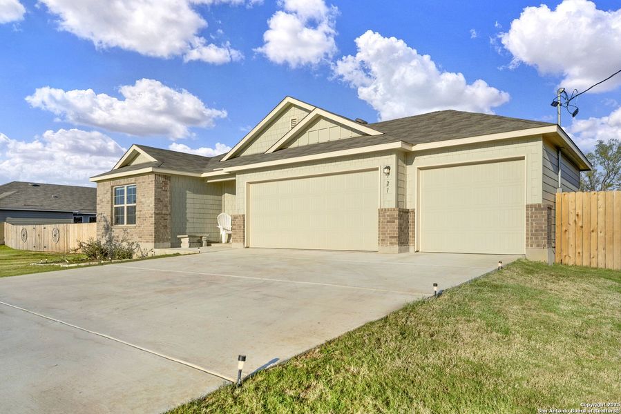 Front exterior of a new home in Chaparral Ranch, Floresville, TX, highlighting curb appeal (Image 21).