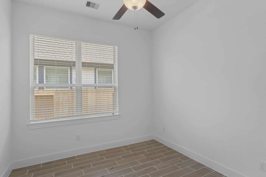 Representative unfurnished interior of a home built from the Mickelson by Chesmar Homes in Riceland Alley Loads, Mont Belvieu (Image 89).
