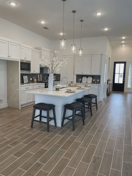 Representative furnished interior of a home built from the Mickelson by Chesmar Homes in Riceland Alley Loads, Mont Belvieu (Image 51).