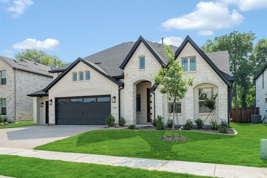 Front exterior of a new home in Legacy Ranch Classic 60, Melissa, TX, highlighting curb appeal (Image 25). Front exterior of a new home in Legacy Ranch Classic 60, Melissa, TX, highlighting curb appeal (Image 25).