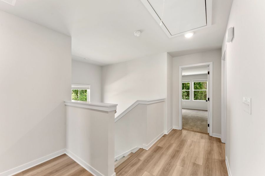 A room with white walls and a wood floor.