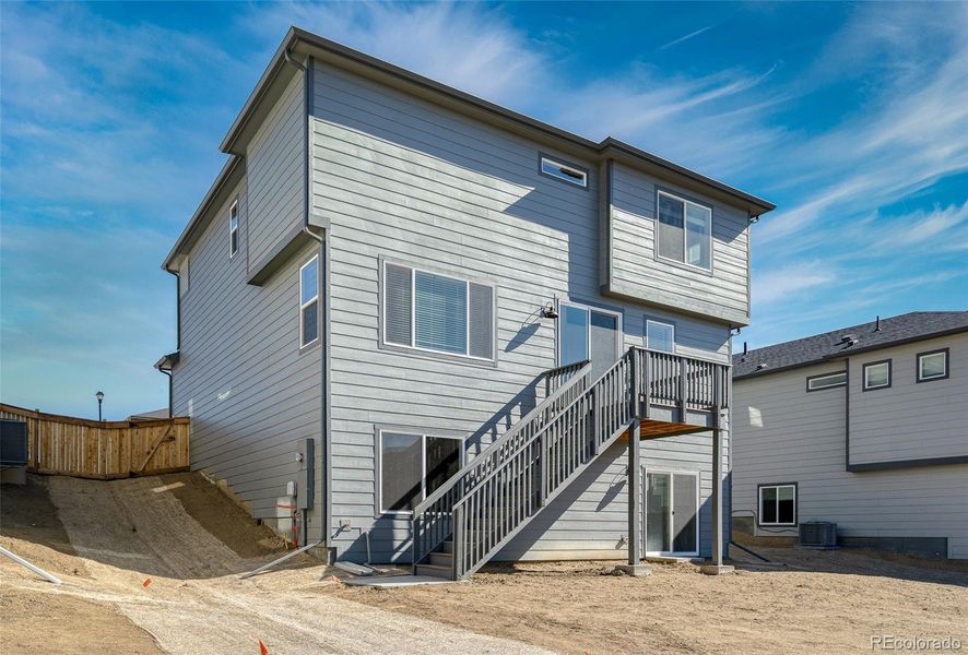 Exterior details and patio area of a home in Buffalo Highlands: The Flora Collection, Commerce City (Image 4).