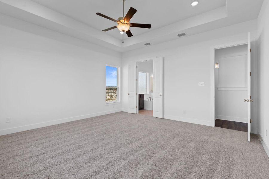 Primary Bedroom with tray ceiling Primary Bedroom with tray ceiling