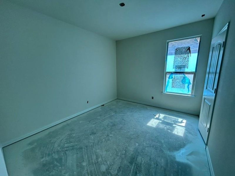 Spare room featuring baseboards