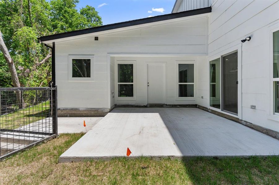 Rear view of property featuring a patio area Rear view of property featuring a patio area