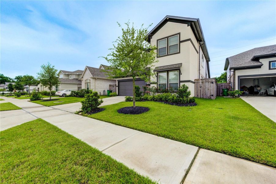 Front exterior of a new home in Sienna 45', 50', Missouri City, TX, highlighting curb appeal (Image 1).