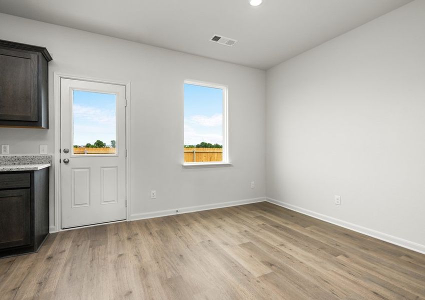 The dining room has large windows. The dining room has large windows.