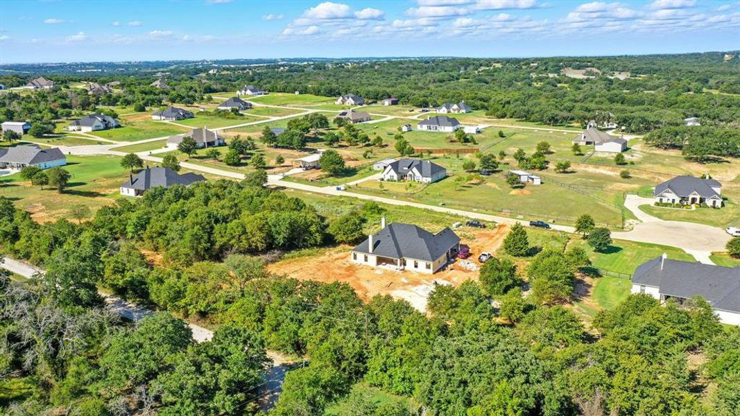 Aerial perspective of suburban area featuring a tree filled landscape Aerial perspective of suburban area featuring a tree filled landscape
