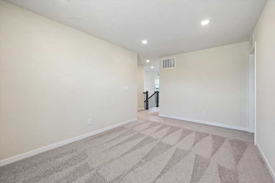 A hallway with a carpet.